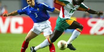 SEOUL - MAY 31:  Bixente Lizarazu of France (left) tackles Moussa Ndiaye of Senegal during the first half of the France v Senegal Group A, World Cup Group Stage match played at the Seoul World Cup Stadium, Seoul, South Korea on May 31, 2002. (Photo by Ben Radford/Getty Images)