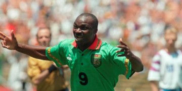 Cameroon's forward Roger Milla celebrates after scoring a goal against Russia 28 June 1994 at Stanford stadium in San Francisco during their Soccer World Cup match. At age 42, Roger Milla became the oldest player ever to score a goal in World Cup history, but could not help his team as Russia won 6-1 with forward Oleg Salenko, scoring a record 5 goals. AFP PHOTO/ANTONIO SCORZA