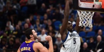 The Wolves' Gorgui Dieng dunks as the Lakers' Larry Nance Jr. watches in the first half as the Minnesota Timberwolves played the Los Angeles Lakers.  (Pioneer Press: Scott Takushi)