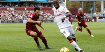 Emmanuel Riviere of Metz and Yannick Gomis of Lens during the French Ligue 2 match between Metz and Lens on September 1, 2018 in Metz, France. (Photo by Fred Marvaux/Icon Sport)