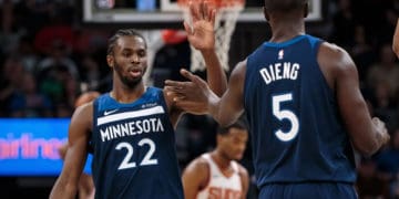 Nov 26, 2017; Minneapolis, MN, USA; Minnesota Timberwolves guard Andrew Wiggins (22) high fives center Gorgui Dieng (5) in the third quarter against the Phoenix Suns at Target Center. Mandatory Credit: Brad Rempel-USA TODAY Sports