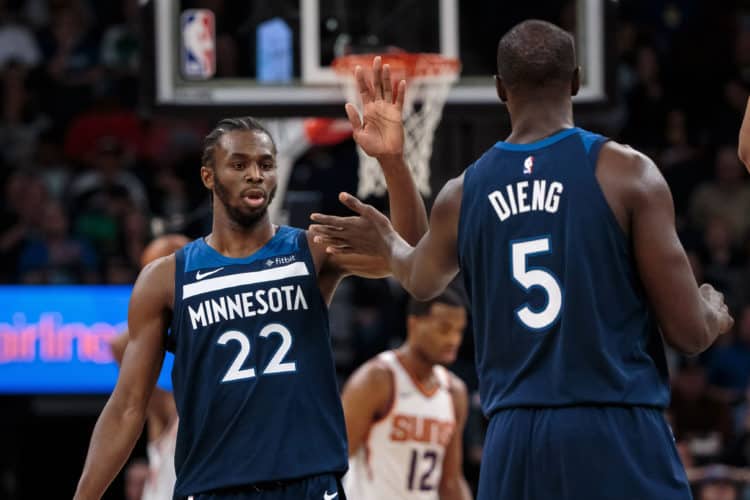 Nov 26, 2017; Minneapolis, MN, USA; Minnesota Timberwolves guard Andrew Wiggins (22) high fives center Gorgui Dieng (5) in the third quarter against the Phoenix Suns at Target Center. Mandatory Credit: Brad Rempel-USA TODAY Sports