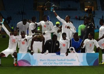 COVENTRY, ENGLAND - APRIL 23:  The Senegal team  celebrate their qualification to the Olympics during the London 2012 Olympic Qualifier match between Senegal and Oman at the Ricoh Arena on April 23, 2012 in Coventry, England.  (Photo by Julian Finney/Getty Images)