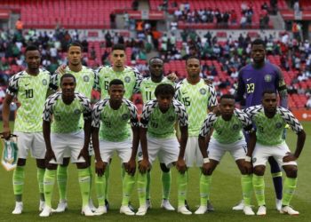 Nigeria team (Back row L-R) Nigeria's midfielder John Obi Mikel, Nigeria's defender William Troost-Ekong, Nigeria's defender Leon Balogun, Nigeria's midfielder Victor Moses, Nigeria's midfielder Joel Obi and Nigeria's goalkeeper Francis Uzoho, (Front row L-R) Nigeria's striker Odion Ighalo, Nigeria's defender Shehu Abdullahi, Nigeria's midfielder Alex Iwobi, Nigeria's midfielder Ogenyi Onazi and Nigeria's defender Bryan Idowu line up for a pre-game photograph ahead of the International friendly football match between England and Nigeria at Wembley stadium in London on June 2, 2018. / AFP PHOTO / Ian KINGTON