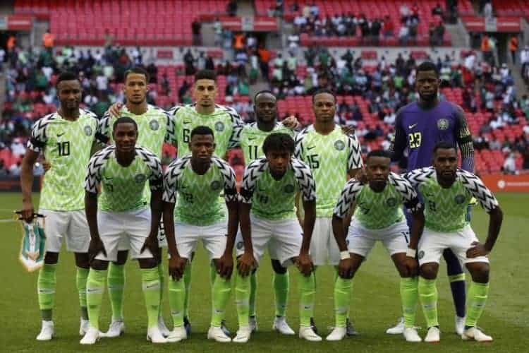 Nigeria team (Back row L-R) Nigeria's midfielder John Obi Mikel, Nigeria's defender William Troost-Ekong, Nigeria's defender Leon Balogun, Nigeria's midfielder Victor Moses, Nigeria's midfielder Joel Obi and Nigeria's goalkeeper Francis Uzoho, (Front row L-R) Nigeria's striker Odion Ighalo, Nigeria's defender Shehu Abdullahi, Nigeria's midfielder Alex Iwobi, Nigeria's midfielder Ogenyi Onazi and Nigeria's defender Bryan Idowu line up for a pre-game photograph ahead of the International friendly football match between England and Nigeria at Wembley stadium in London on June 2, 2018. / AFP PHOTO / Ian KINGTON