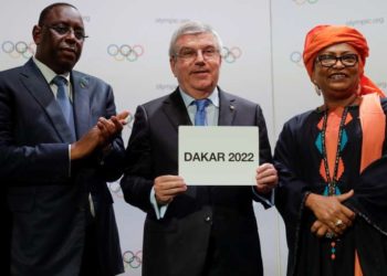 Senegal's President Macky Sall and International Olympic Committee (IOC) President Thomas Bach, alongside mayor of Dakar Soham El Wardini, pose after signing the contract for 2022, when Senegal will host the Youth Olympic Games, at the 133rd IOC session in Buenos Aires, Argentina October 8, 2018. Natacha Pisarenko/Pool via REUTERS - RC11C1E94180