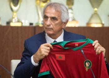 Bosnian coach Vahid Halilhodzic poses with Morocco's national team jersey after signing on as the new coach during a press conference in the capital Rabat on August 15, 2019. (Photo by FADEL SENNA / AFP)