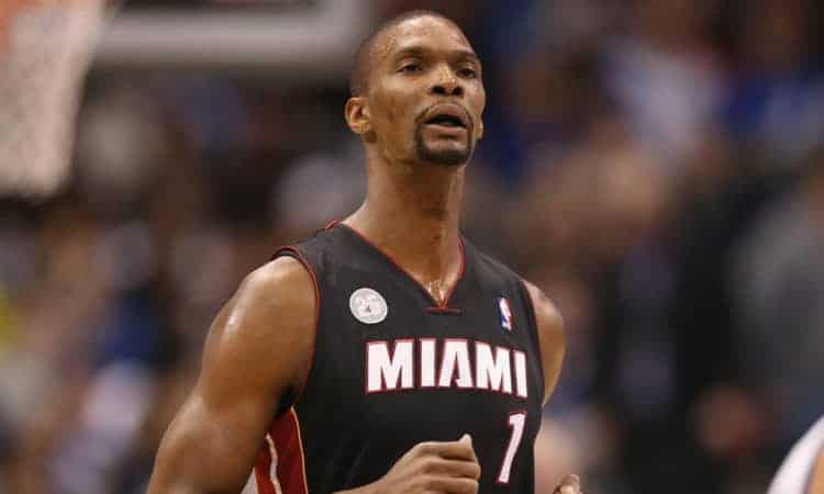 DALLAS, TX - DECEMBER 20:  Chris Bosh #1 of the Miami Heat at American Airlines Center on December 20, 2012 in Dallas, Texas.  NOTE TO USER: User expressly acknowledges and agrees that, by downloading and or using this photograph, User is consenting to the terms and conditions of the Getty Images License Agreement.  (Photo by Ronald Martinez/Getty Images)