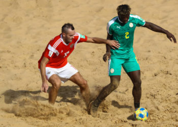ASUNCION, PARAGUAY - NOVEMBER 22: Ninou Diatta of Senegal is challenged by Artur Paporotnyi of Russia during the FIFA Beach Soccer World Cup Paraguay 2019 group C match between Senegal and Russia at Estadio Mundialista Los Pynandi on November 22, 2019 in Asuncion, Paraguay. (Photo by Buda Mendes - FIFA/FIFA via Getty Images)