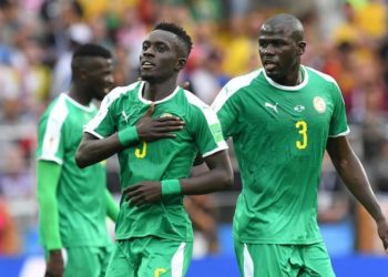 Senegal's midfielder Idrissa Gana Gueye (L) and Senegal's defender Kalidou Koulibaly celebrate after Poland conceded the opening goal during the Russia 2018 World Cup Group H football match between Poland and Senegal at the Spartak Stadium in Moscow on June 19, 2018. / AFP PHOTO / Francisco LEONG / RESTRICTED TO EDITORIAL USE - NO MOBILE PUSH ALERTS/DOWNLOADS