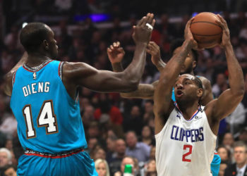 LOS ANGELES, CALIFORNIA - FEBRUARY 24:  Kawhi Leonard #2 of the LA Clippers looks to shoot past the defense of Gorgui Dieng #14 of the Memphis Grizzlies  during the first half of a game against the Memphis Grizzlies at Staples Center on February 24, 2020 in Los Angeles, California.  NOTE TO USER: User expressly acknowledges and agrees that, by downloading and/or using this photograph, user is consenting to the terms and conditions of the Getty Images License Agreement. (Photo by Sean M. Haffey/Getty Images)