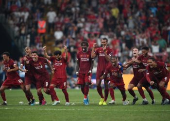 Liverpool's players celebrate winning the UEFA Super Cup 2019 football match between FC Liverpool and FC Chelsea at Besiktas Park Stadium in Istanbul on August 14, 2019. (Photo by Bulent Kilic / AFP)
