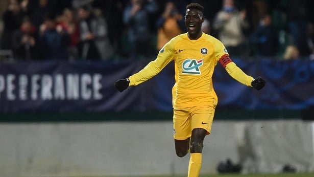 Pau's senegalian Name Moustapha celebrates after scoring a goal during the French Cup football match between FC Pau and Girondins de Bordeaux at the Stade du Hameau Stadium in Pau, southwestern France, on January 16, 2020. (Photo by GAIZKA IROZ / AFP)