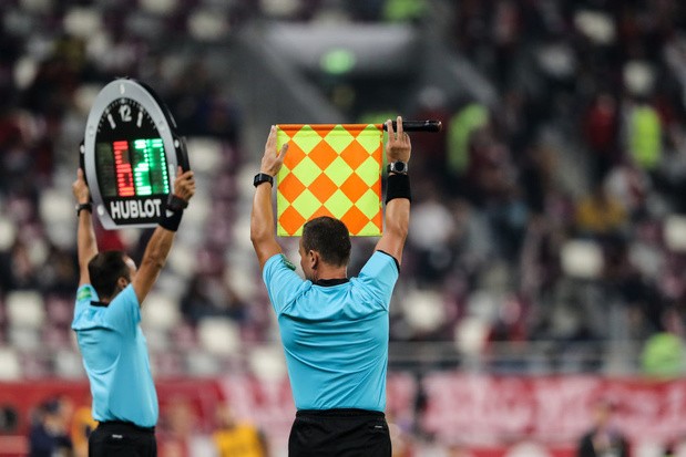 DOHA, QATAR - DECEMBER 21: A linesman holds up his flag for a substitution during the FIFA Club World Cup Qatar 2019 Third Place Play Off match between Monterrey and Al Halil FC at Khalifa International Stadium on December 21, 2019 in Doha, Qatar. (Photo by Matthew Ashton - AMA/Getty Images)