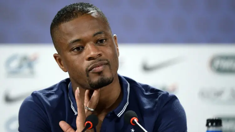 France's defender Patrice Evra gives a press conference in Ribeirao Preto on June 18, 2014 during the 2014 FIFA World Cup in Brazil. AFP PHOTO / FRANCK FIFE (Photo by FRANCK FIFE / AFP)