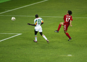 OSAKA - JUNE 22:  Ilhan Mansiz of Turkey scores the golden goal during the FIFA World Cup Finals 2002 Quarter Finals match between Senegal and Turkey played at the Osaka-Nagai Stadium, in Osaka, Japan on June 22, 2002. Turkey won the match 1-0 with a Golden Goal in extra-time. DIGITAL IMAGE. (Photo by David Cannon/Getty Images)