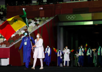 TOKYO, JAPAN - JULY 23: Flag bearers Jeanne Boutbien and Mbagnick Ndiaye of Team Senegal lead their team out during the Opening Ceremony of the Tokyo 2020 Olympic Games at Olympic Stadium on July 23, 2021 in Tokyo, Japan. (Photo by Jamie Squire/Getty Images)