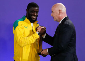 FIFA President Gianni Infantino (R) presents Raoul Mendy of Senegal with his Bronze Ball award during the prize-giving ceremony of the FIFA Beach Soccer World Cup Russia 2021 on August 29, 2021 at Luzhniki Beach Soccer Stadium in Moscow, Russia. (Photo by Mike Kireev/NurPhoto via Getty Images)