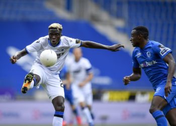 GENK, BELGIUM - AUGUST 30 : Youssouph Badji  forward of Club Brugge and Jhon Lucumi defender of Genk during the Jupiler Pro League match between KRC Genk and Club Brugge KV on August 30, 2020 in Genk, Belgium, 30/08/2020 ( Photo by Sebastien Smets / Photonews