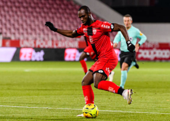 DIJON, FRANCE - JANUARY 09: Moussa Konate of Dijon attempts a kick during the Ligue 1 match between Dijon FCO and Olympique Marseille at Stade Gaston Gerard on January 9, 2021 in Dijon, France. (Photo by Marcio Machado/Eurasia Sport Images/Getty Images)