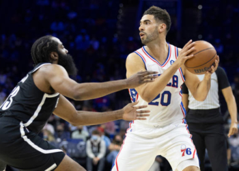 PHILADELPHIA, PA - OCTOBER 11: Georges Niang #20 of the Philadelphia 76ers controls the ball against James Harden #13 of the Brooklyn Nets at the Wells Fargo Center on October 11, 2021 in Philadelphia, Pennsylvania. NOTE TO USER: User expressly acknowledges and agrees that, by downloading and or using this photograph, User is consenting to the terms and conditions of the Getty Images License Agreement. (Photo by Mitchell Leff/Getty Images)