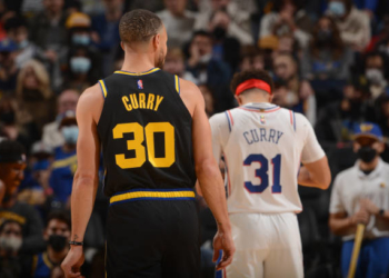 SAN FRANCISCO, CA - NOVEMBER 24: Stephen Curry #30 of the Golden State Warriors looks on during the game against the Philadelphia 76ers on November 24, 2021 at Chase Center in San Francisco, California. NOTE TO USER: User expressly acknowledges and agrees that, by downloading and or using this photograph, user is consenting to the terms and conditions of Getty Images License Agreement. Mandatory Copyright Notice: Copyright 2021 NBAE (Photo by Noah Graham/NBAE via Getty Images)