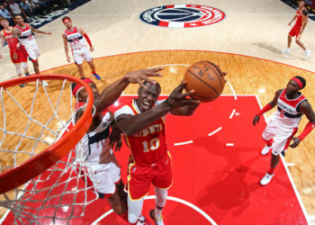 WASHINGTON, DC -  OCTOBER 28:  Gorgui Dieng #10 of the Atlanta Hawks drives to the basket against the Washington Wizards on October 28, 2021 at Capital One Arena in Washington, DC. NOTE TO USER: User expressly acknowledges and agrees that, by downloading and or using this Photograph, user is consenting to the terms and conditions of the Getty Images License Agreement. Mandatory Copyright Notice: Copyright 2021 NBAE (Photo by Stephen Gosling/NBAE via Getty Images)