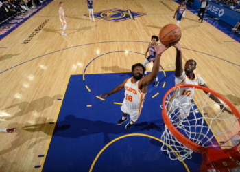 SAN FRANCISCO, CA - NOVEMBER 8: Solomon Hill #18 and Gorgui Dieng #10 of the Atlanta Hawks grabs the rebound during the game against the Golden State Warriors on November 8, 2021 at Chase Center in San Francisco, California. NOTE TO USER: User expressly acknowledges and agrees that, by downloading and or using this photograph, user is consenting to the terms and conditions of Getty Images License Agreement. Mandatory Copyright Notice: Copyright 2021 NBAE (Photo by Noah Graham/NBAE via Getty Images)