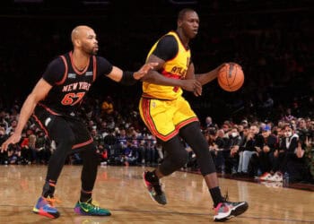 NEW YORK, NY - DECEMBER 25: Taj Gibson #67 of the New York Knicks plays defense on Gorgui Dieng #10 of the Atlanta Hawks during the game on December 25, 2021 at Madison Square Garden in New York City, New York.  NOTE TO USER: User expressly acknowledges and agrees that, by downloading and or using this photograph, User is consenting to the terms and conditions of the Getty Images License Agreement. Mandatory Copyright Notice: Copyright 2021 NBAE  (Photo by Nathaniel S. Butler/NBAE via Getty Images)