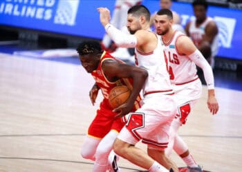 CHICAGO, IL - DECEMBER 29: Chicago Bulls Center Nikola Vucevic (9) posts up against Atlanta Hawks Center Clint Capela (15) during a NBA game between the Atlanta  Hawks and the Chicago Bulls on December 29, 2021 at the United Center in Chicago, IL. (Photo by Melissa Tamez/Icon Sportswire via Getty Images)