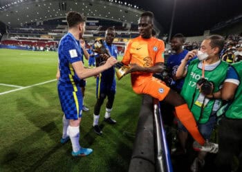 ABU DHABI, UNITED ARAB EMIRATES - FEBRUARY 12: Edouard Mendy of Chelsea celebrates with the trophy during the FIFA Club World Cup UAE 2021 Final match between Chelsea v Palmeiras at Mohammed Bin Zayed Stadium on February 12, 2022 in Abu Dhabi, United Arab Emirates. (Photo by Matthew Ashton - AMA/Getty Images)