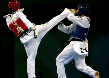 BEIJING - AUGUST 21:  Veronica Calabrese of Italy (blue) fights Bineta Diedhiou of Senegal (red) in the Women -57kg Quarterfinal match held at the Beijing Science and Technology University Gymnasium during Day 13 of the Beijing 2008 Olympic Games on August 21, 2008 in Beijing, China.  (Photo by Clive Rose/Getty Images)