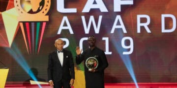 07 January 2020, Egypt, Hurghada: Senegalese footballer Sadio Mane (R) receives the Player of the Year award from CAF President Ahmad Ahmad during the 2019 CAF Awards ceremony at Albatros Citadel. Photo: Ibrahim Youssef/dpa (Photo by Ibrahim Youssef/picture alliance via Getty Images)