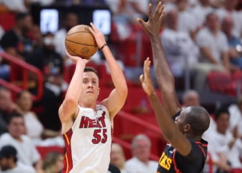 MIAMI, FLORIDA - APRIL 17: Duncan Robinson #55 of the Miami Heat shoots a three pointer over Gorgui Dieng #10 of the Atlanta Hawks during the second half in Game One of the Eastern Conference First Round at FTX Arena on April 17, 2022 in Miami, Florida. NOTE TO USER: User expressly acknowledges and agrees that, by downloading and or using this photograph, User is consenting to the terms and conditions of the Getty Images License Agreement.  (Photo by Michael Reaves/Getty Images)