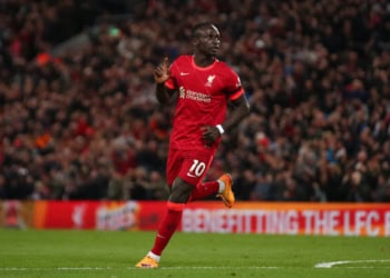 LIVERPOOL, ENGLAND - APRIL 19: Sadio Mane of Liverpool celebrates scoring his side's third goal during the Premier League match between Liverpool and Manchester United at Anfield on April 19, 2022 in Liverpool, England. (Photo by Chris Brunskill/Fantasista/Getty Images)