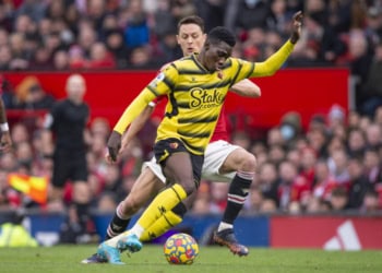 MANCHESTER, ENGLAND - FEBRUARY 26: Nemanja Matic of Manchester United and Ismaila Sarr of Watford in action during the Premier League match between Manchester United and Watford at Old Trafford on February 26, 2022 in Manchester, United Kingdom. (Photo by Joe Prior/Visionhaus via Getty Images)