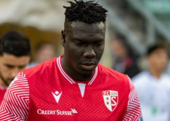 SION, SWITZERLAND - MARCH 03: Birama Ndoye #34 of FC Sion enters the pitch before the Super League match between FC Sion and FC Lausanne-Sport at Stade Tourbillon on March 3, 2022 in Sion, Switzerland. (Photo by RvS.Media/Basile Barbey/Getty Images)