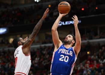 CHICAGO, ILLINOIS - OCTOBER 29: Georges Niang #20 of the Philadelphia 76ers shoots over Coby White #0 of the Chicago Bulls in the first half on October 29, 2022 at the United Center in Chicago, Illinois.  NOTE TO USER: User expressly acknowledges and agrees that, by downloading and or using this photograph, User is consenting to the terms and conditions of the Getty Images License Agreement. (Photo by Jamie Sabau/Getty Images)