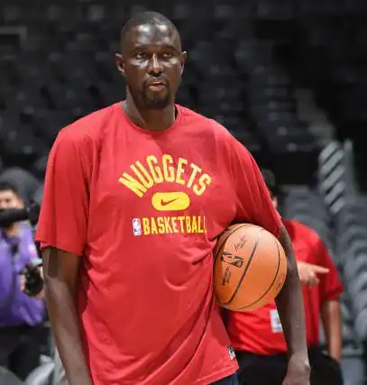 De l'équipe nationale à la NBA : Boniface Ndong raconte son parcours exceptionnel - wiwsport LOS ANGELES, CA - OCTOBER 4: Player Development Coach, Boniface NDong of the Denver Nuggets looks on before the game against the LA Clippers on October 4, 2021, 2021 at STAPLES Center in Los Angeles, California. NOTE TO USER: User expressly acknowledges and agrees that, by downloading and/or using this Photograph, user is consenting to the terms and conditions of the Getty Images License Agreement. Mandatory Copyright Notice: Copyright 2021 NBAE (Photo by Andrew D. Bernstein/NBAE via Getty Images)