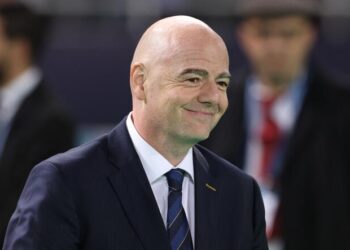 FIFA President Gianni Infantino arrives on the pitch at the end of during the FIFA Club World Cup final football match between Spain's Real Madrid and Saudi Arabia's Al-Hilal at the Prince Moulay Abdellah Stadium in Rabat on February 11, 2023.  (Photo by Fadel Senna / AFP)