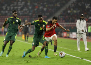 (20) Bouna Sarr of Senegal team battel for the ball with (7) Trézéguet of Egypt team during the 2021 Africa Cup of Nations final soccer match between Senegal and Egypt at the Paul Biya 'Olembe' Stadium, Yaounde, Cameroon 06 February 2022. (Photo by Ayman Aref/NurPhoto via Getty Images)