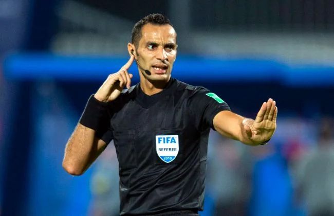 Elimi Mondial 2026 - Togo vs Sénégal : l'arbitre Mustapha Ghorbal au sifflet - wiwsport Elimi Mondial 2026 - Togo vs Sénégal : l'arbitre Mustapha Ghorbal au sifflet - wiwsport