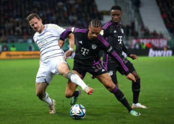 SAARBRUECKEN, GERMANY - NOVEMBER 01: Marcel Gaus of FC Saarbrücken battles for possession with Leroy Sane of Bayern Munich during the DFB cup second round match between 1. FC Saarbrücken and FC Bayern München at Ludwigsparkstadion on November 01, 2023 in Saarbruecken, Germany. (Photo by Alex Grimm/Getty Images)