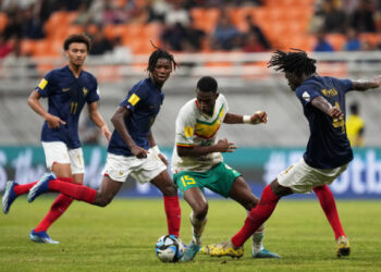 JAKARTA, INDONESIA - NOVEMBER 22: Idrissa Gueye of Senegal is challenged by Bastien Meupiyou of France during the FIFA U-17 World Cup Round of 16 match between France and Senegal at Jakarta International Stadium on November 22, 2023 in Jakarta, Indonesia. (Photo by Alex Caparros - FIFA/FIFA via Getty Images)