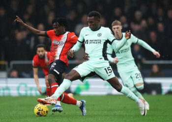 LUTON, ENGLAND - DECEMBER 30: Issa Kabore of Luton Town challenges for the ball with Nicolas Jackson of Chelsea during the Premier League match between Luton Town and Chelsea FC at Kenilworth Road on December 30, 2023 in Luton, England. (Photo by Chris Lee - Chelsea FC/Chelsea FC via Getty Images)