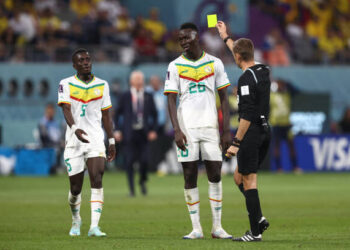 DOHA, QATAR - NOVEMBER 29: Idrissa Gueye of Senegal is shown a yellow card during the FIFA World Cup Qatar 2022 Group A match between Ecuador and Senegal at Khalifa International Stadium on November 29, 2022 in Doha, Qatar. (Photo by James Williamson - AMA/Getty Images)