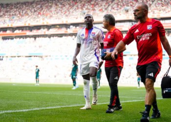 Amin SARR of Lyon leave the pitch injured during the Ligue 1 MCDonald's match between Lyon and Monaco at Groupama Stadium on August 24, 2024 in Lyon, France. (Photo by Hugo Pfeiffer/Icon Sport via Getty Images)