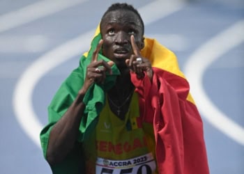 Senegal's Louis Francois Mendy (C) celebrates after winning the gold medal in the men's 110m hurdles final during the 13th African Games at the University of Ghana stadium in Accra on March 19, 2024. (Photo by Monirul Bhuiyan / AFP) (Photo by MONIRUL BHUIYAN/AFP via Getty Images)