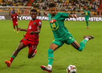 DIAMNIADIO, SENEGAL - OCTOBER 11: Ismail Jakobs (R) of Senegal in action against Wise D. Mpinganjira (L) of Malawi during the Africa Cup of Nations 2025 Qualifiers football match between Senegal and Malawi at Abdoulaye Wade Stadum in Diamniadio, Senegal on October 11, 2024. (Photo by Cem Ozdel/Anadolu via Getty Images)