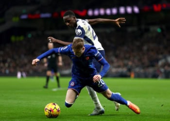 LONDON, ENGLAND - DECEMBER 08: Pape Matar Sarr of Tottenham Hotspur tackles Cole Palmer of Chelsea FC resulting in a penalty during the Premier League match between Tottenham Hotspur FC and Chelsea FC at Tottenham Hotspur Stadium on December 08, 2024 in London, England. (Photo by Chloe Knott - Danehouse/Getty Images)